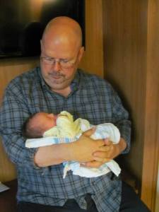 To all you parents, including my own: thank you for loving and caring for your children so faithfully, for every "one more" you've tended to! (Photo: my Papa holding my cousin, Isaac, his 8th grandbaby)