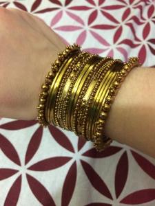 There are a variety of ways to wear sets of bangles, often a matching set on each arm. Women often coordinate their bangles with their sarees (or other outfits). If anyone knows how to accessorize, it is definitely Indian women!